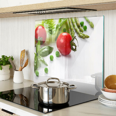 Glass chopping board Vegetables on a white countertop