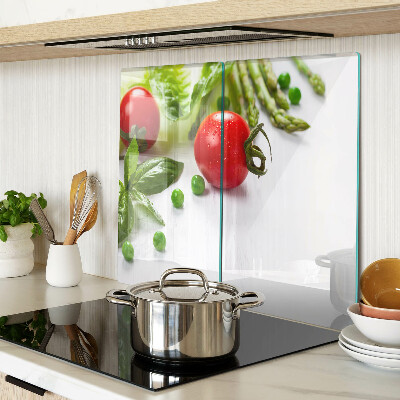 Glass chopping board Vegetables on a white countertop