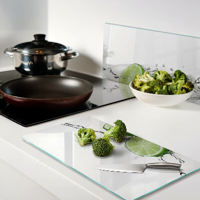 Glass kitchen board Lemons in water