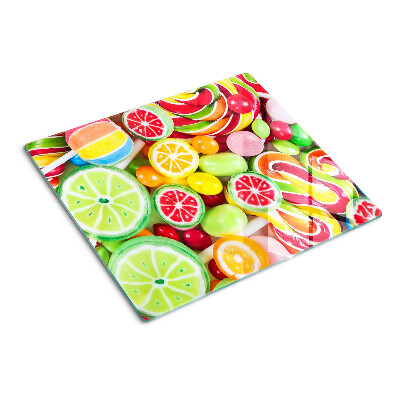 Glass kitchen board Sweet candies and fruits