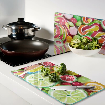 Glass kitchen board Sweet candies and fruits