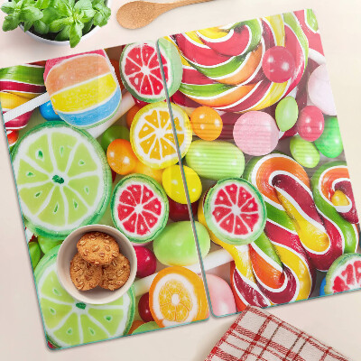 Glass kitchen board Sweet candies and fruits