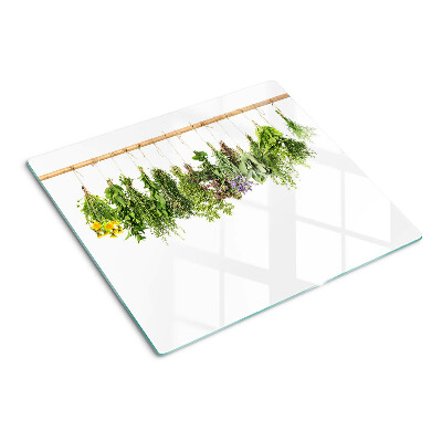 Glass kitchen board Dried herbs on a string