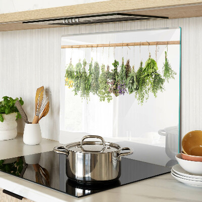 Glass kitchen board Dried herbs on a string