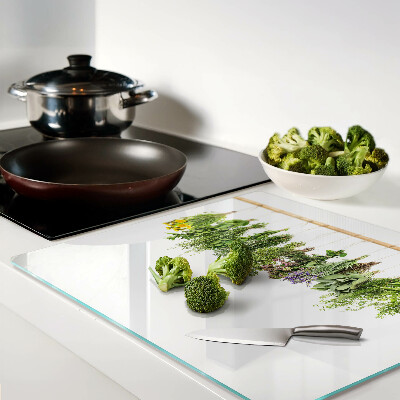 Glass kitchen board Dried herbs on a string