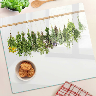 Glass kitchen board Dried herbs on a string