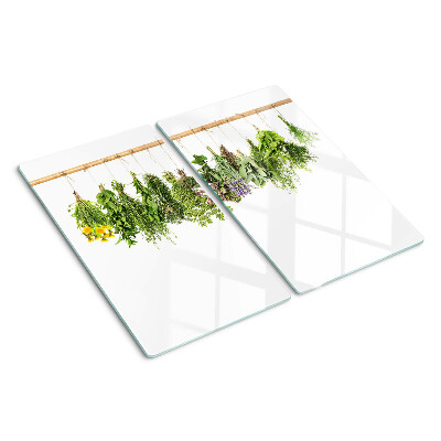 Glass kitchen board Dried herbs on a string