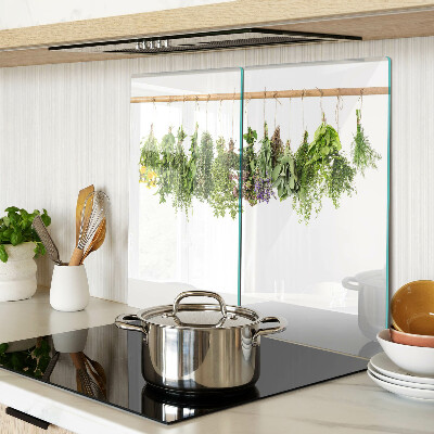 Glass kitchen board Dried herbs on a string