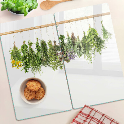 Glass kitchen board Dried herbs on a string