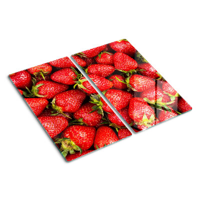 Glass chopping board Strawberries on a red background
