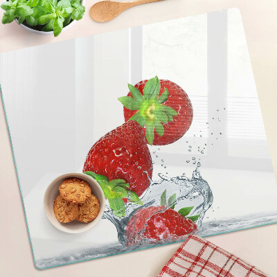 Glass kitchen board Strawberries in water