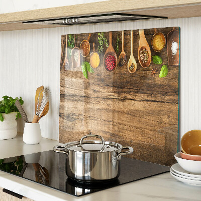 Glass kitchen board Spices and herbs on a wooden background
