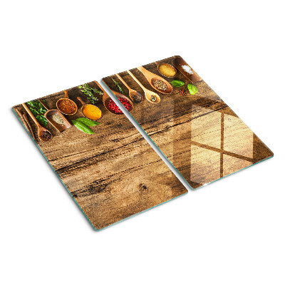 Glass kitchen board Spices and herbs on a wooden background