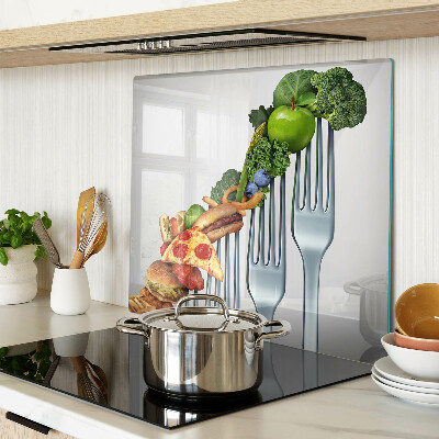Glass kitchen board Food on a fork