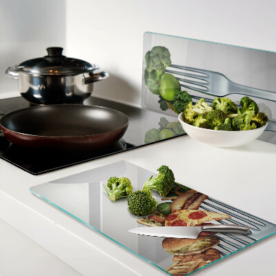 Glass kitchen board Food on a fork