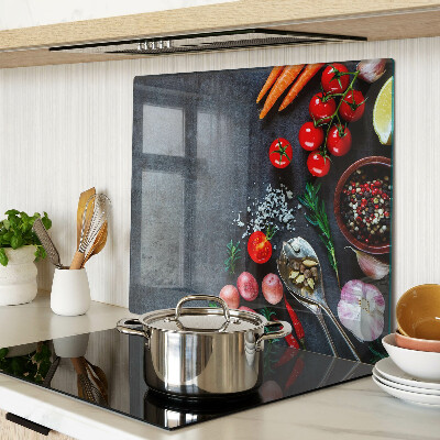 Glass kitchen board Vegetables and spices on a dark background