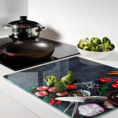 Glass kitchen board Vegetables and spices on a dark background