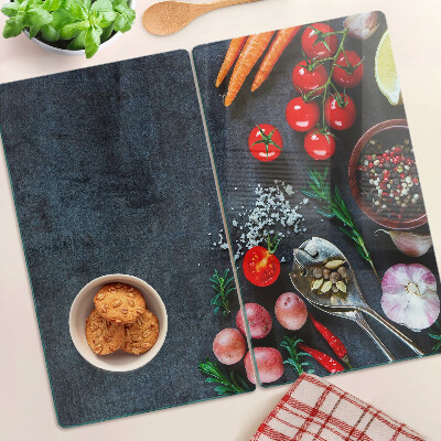 Glass kitchen board Vegetables and spices on a dark background