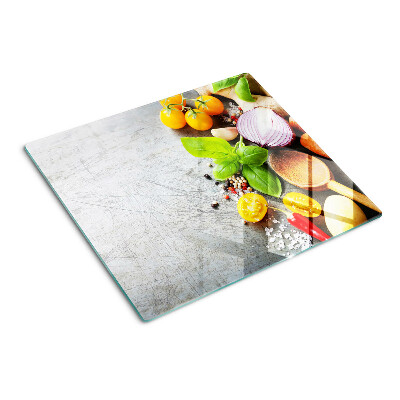 Glass chopping board Kitchen ingredients and herbs