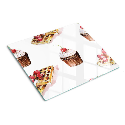 Glass chopping board Waffles and cupcakes with cherries