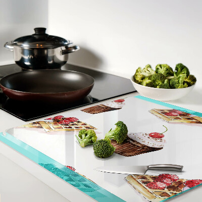 Glass chopping board Waffles and cupcakes with cherries