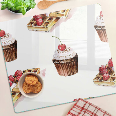 Glass chopping board Waffles and cupcakes with cherries
