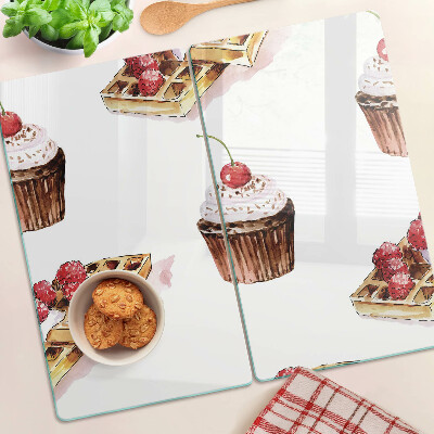 Glass chopping board Waffles and cupcakes with cherries