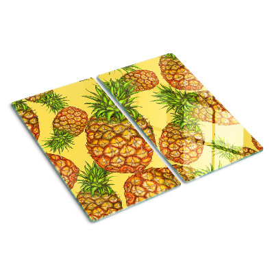 Glass kitchen board Pineapples on a yellow background