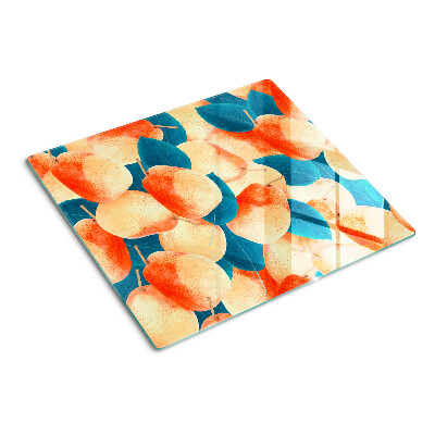 Glass chopping board Peaches against the background of leaves