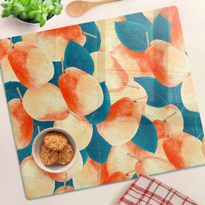 Glass chopping board Peaches against the background of leaves