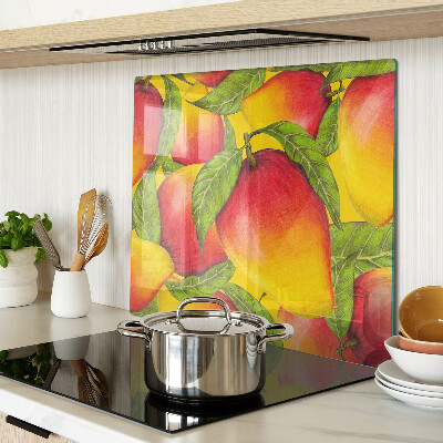 Glass chopping board Peppers on a background of green leaves