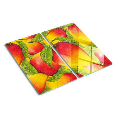 Glass chopping board Peppers on a background of green leaves