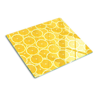 Glass kitchen board Lemon slices on a yellow background