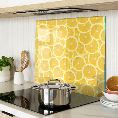 Glass kitchen board Lemon slices on a yellow background