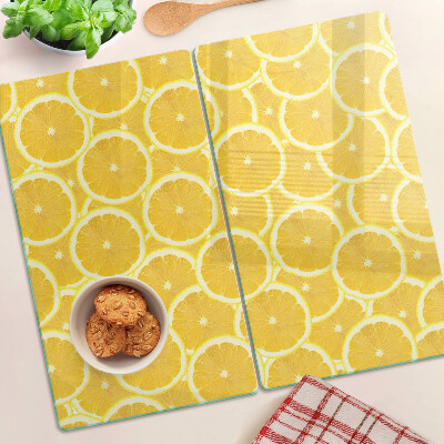 Glass kitchen board Lemon slices on a yellow background