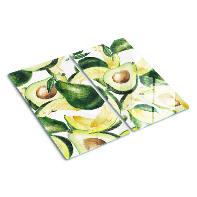 Glass kitchen board Avocado on a background of leaves