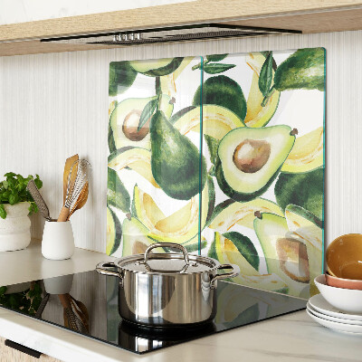 Glass kitchen board Avocado on a background of leaves