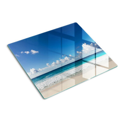 Glass kitchen board Beach with turquoise water and clouds