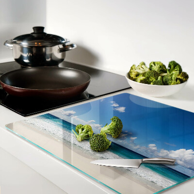 Glass kitchen board Beach with turquoise water and clouds