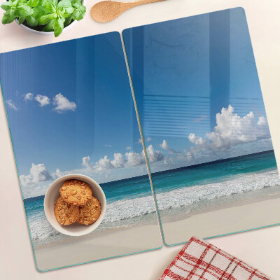 Glass kitchen board Beach with turquoise water and clouds