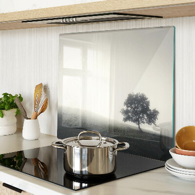 Glass chopping board A tree in a misty landscape