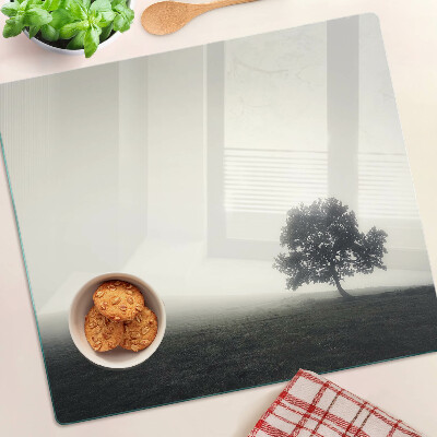 Glass chopping board A tree in a misty landscape
