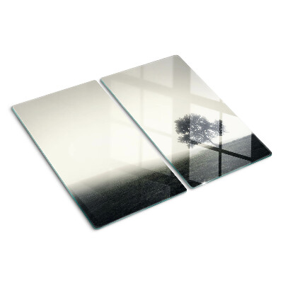 Glass chopping board A tree in a misty landscape