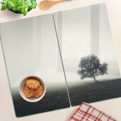 Glass chopping board A tree in a misty landscape