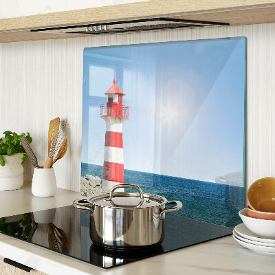 Glass kitchen board Lighthouse over the ocean