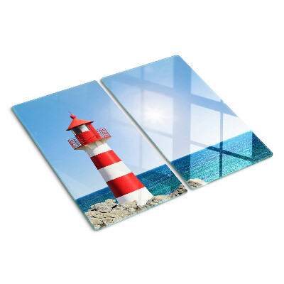 Glass kitchen board Lighthouse over the ocean
