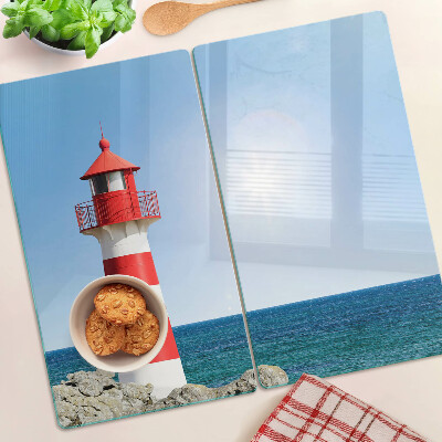 Glass kitchen board Lighthouse over the ocean