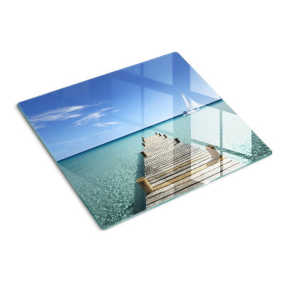 Glass kitchen board Pier over the turquoise sea