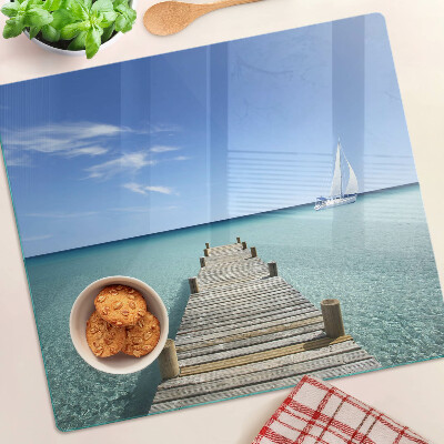 Glass kitchen board Pier over the turquoise sea