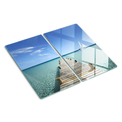 Glass kitchen board Pier over the turquoise sea